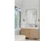 Bright bathroom featuring a vanity with a marble countertop, elegant lighting, and big windows at 1026 Reeder N Cir, Atlanta, GA 30306