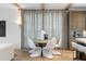 Dining room with modern table and chairs, designer lighting and custom cabinets at 1026 Reeder N Cir, Atlanta, GA 30306