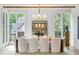 Elegant dining room with a wooden table and large windows at 1026 Reeder N Cir, Atlanta, GA 30306