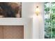 Close-up of a living area featuring a white fireplace and a sconce at 1026 Reeder N Cir, Atlanta, GA 30306