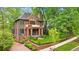 Beautiful brick home with lush landscaping, a walkway, and a well-manicured front yard at 1026 Reeder N Cir, Atlanta, GA 30306