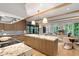 Open-concept kitchen with kitchen island, stainless appliances and exposed beams at 1026 Reeder N Cir, Atlanta, GA 30306