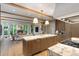 Open concept kitchen with large island, designer lighting and an adjacent Gathering room at 1026 Reeder N Cir, Atlanta, GA 30306