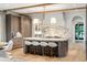Stylish kitchen featuring an island with seating, modern lighting, and custom wood cabinetry at 1026 Reeder N Cir, Atlanta, GA 30306