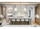 Modern kitchen featuring an island with bar seating, marble counters and designer lighting at 1026 Reeder N Cir, Atlanta, GA 30306