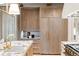 Gourmet kitchen featuring stainless appliances, custom cabinets and marble countertops at 1026 Reeder N Cir, Atlanta, GA 30306