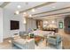 Spacious open floor plan with exposed beams, modern furnishings, and seamless flow to the kitchen at 1026 Reeder N Cir, Atlanta, GA 30306