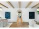 Bright and airy living area featuring hardwood floors, neutral walls, exposed beams, and stylish decor at 1026 Reeder N Cir, Atlanta, GA 30306