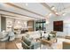 Open concept living area with exposed beams, modern lighting, and seamless flow to the kitchen at 1026 Reeder N Cir, Atlanta, GA 30306