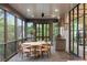 Inviting outdoor screened porch with a ceiling fan and a complete grilling station at 1026 Reeder N Cir, Atlanta, GA 30306