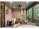 Inviting screened in porch featuring contemporary decor and a comfortable seating area at 1026 Reeder N Cir, Atlanta, GA 30306