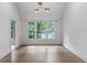Room with hardwood floors, white walls and windows looking out to a yard at 1026 Reeder N Cir, Atlanta, GA 30306