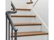 Elegant staircase with wood steps and painted risers, complemented by a decorative metal railing at 1026 Reeder N Cir, Atlanta, GA 30306