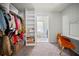 Spacious walk-in closet with built-in shelving and a dressing area at 1755 Fairburn Sw Rd, Atlanta, GA 30331