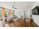 Bright living room featuring a comfortable sectional sofa, hardwood floors, and neutral walls at 1755 Fairburn Sw Rd, Atlanta, GA 30331