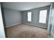 Neutral bedroom offers natural light and plush carpet flooring at 755 Heritage Valley Rd, Norcross, GA 30093