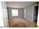 Spacious bedroom features neutral paint, plush carpet and natural light at 755 Heritage Valley Rd, Norcross, GA 30093