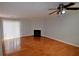Bright living room boasts hardwood floors, fireplace, and sliding glass doors to the exterior at 755 Heritage Valley Rd, Norcross, GA 30093