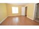 Bright bedroom with closet and full bathroom featuring laminate floors and neutral walls at 775 Heritage Valley Rd, Norcross, GA 30093