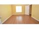 Bright bedroom featuring laminate floors, a window for natural light, and a closet at 775 Heritage Valley Rd, Norcross, GA 30093