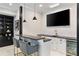 Stylish bar area featuring black countertops, pendant lighting, and a built-in beverage refrigerator at 980 Fenimore Cir, Atlanta, GA 30350