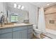 Well-lit bathroom boasts a tub-shower combination and a vanity with generous counter space at 980 Fenimore Cir, Atlanta, GA 30350