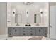 A modern bathroom boasts double sinks, stylish fixtures, and elegant marble accents at 980 Fenimore Cir, Atlanta, GA 30350