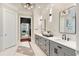 Elegant bathroom with dual vanities, marble accents, and stylish lighting fixtures at 980 Fenimore Cir, Atlanta, GA 30350