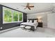 Bright bedroom offers a large window, ceiling fan, and neutral walls for a relaxing retreat at 980 Fenimore Cir, Atlanta, GA 30350