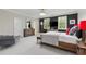 The spacious primary bedroom offers a sitting area, a decorative rug and dark wood accents at 980 Fenimore Cir, Atlanta, GA 30350