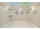Empty bonus room features a minimal design, custom sound panels, and tiled floors at 980 Fenimore Cir, Atlanta, GA 30350