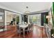 The elegant dining room includes a large table with seating for eight and a bay window at 980 Fenimore Cir, Atlanta, GA 30350