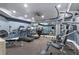 Well-equipped home gym with multiple treadmills, weight machines, and mirrored walls at 980 Fenimore Cir, Atlanta, GA 30350