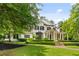 Beautiful two-story home with lush green lawn and mature trees at 980 Fenimore Cir, Atlanta, GA 30350