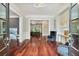 The foyer features beautiful hardwood floors, stylish decor, and natural light streaming in from outside at 980 Fenimore Cir, Atlanta, GA 30350