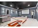 Basement home theater with projector, screen, and comfortable seating with great acoustics at 980 Fenimore Cir, Atlanta, GA 30350