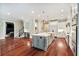 Spacious kitchen with a large island, stainless steel appliances, and hardwood floors, perfect for entertaining at 980 Fenimore Cir, Atlanta, GA 30350