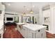 Bright, open kitchen with a large island, marble countertops, and modern appliances overlooking the living area at 980 Fenimore Cir, Atlanta, GA 30350