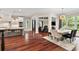 Open-concept kitchen with a dining area and a view of the living room, showcasing modern design at 980 Fenimore Cir, Atlanta, GA 30350