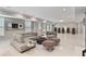 Bright living room with neutral tones, an arcade game setup, and large windows for natural light at 980 Fenimore Cir, Atlanta, GA 30350