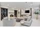 Open-concept living room with a fireplace, bar area, and comfortable seating for entertaining at 980 Fenimore Cir, Atlanta, GA 30350