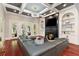Spacious living room with a fireplace, hardwood floors, and a modern lighting fixture at 980 Fenimore Cir, Atlanta, GA 30350