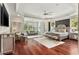 Large main bedroom features a seating area, windows, and hardwood flooring at 980 Fenimore Cir, Atlanta, GA 30350