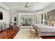 Expansive main bedroom with seating area, large windows, and hardwood flooring at 980 Fenimore Cir, Atlanta, GA 30350