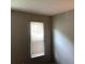 Neutral bedroom showcasing a bright window and a minimalistic style for a calming atmosphere at 985 Romer Pl, Stone Mountain, GA 30083
