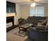 Cozy living room boasts a fireplace and large window and a comfortable sectional sofa at 985 Romer Pl, Stone Mountain, GA 30083
