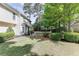 Well-maintained backyard featuring a lush lawn and a patio area perfect for outdoor entertaining at 1008 Post Horn Run, Lawrenceville, GA 30045