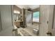 Bathroom featuring a soaking tub, separate shower, and a vanity with ample counter space at 1008 Post Horn Run, Lawrenceville, GA 30045