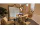 Bright dining area featuring stylish light fixtures, a glass table, and neutral decor at 1008 Post Horn Run, Lawrenceville, GA 30045