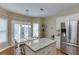 Well-lit kitchen with granite countertops, stainless steel appliances, and a cozy dining area at 1008 Post Horn Run, Lawrenceville, GA 30045